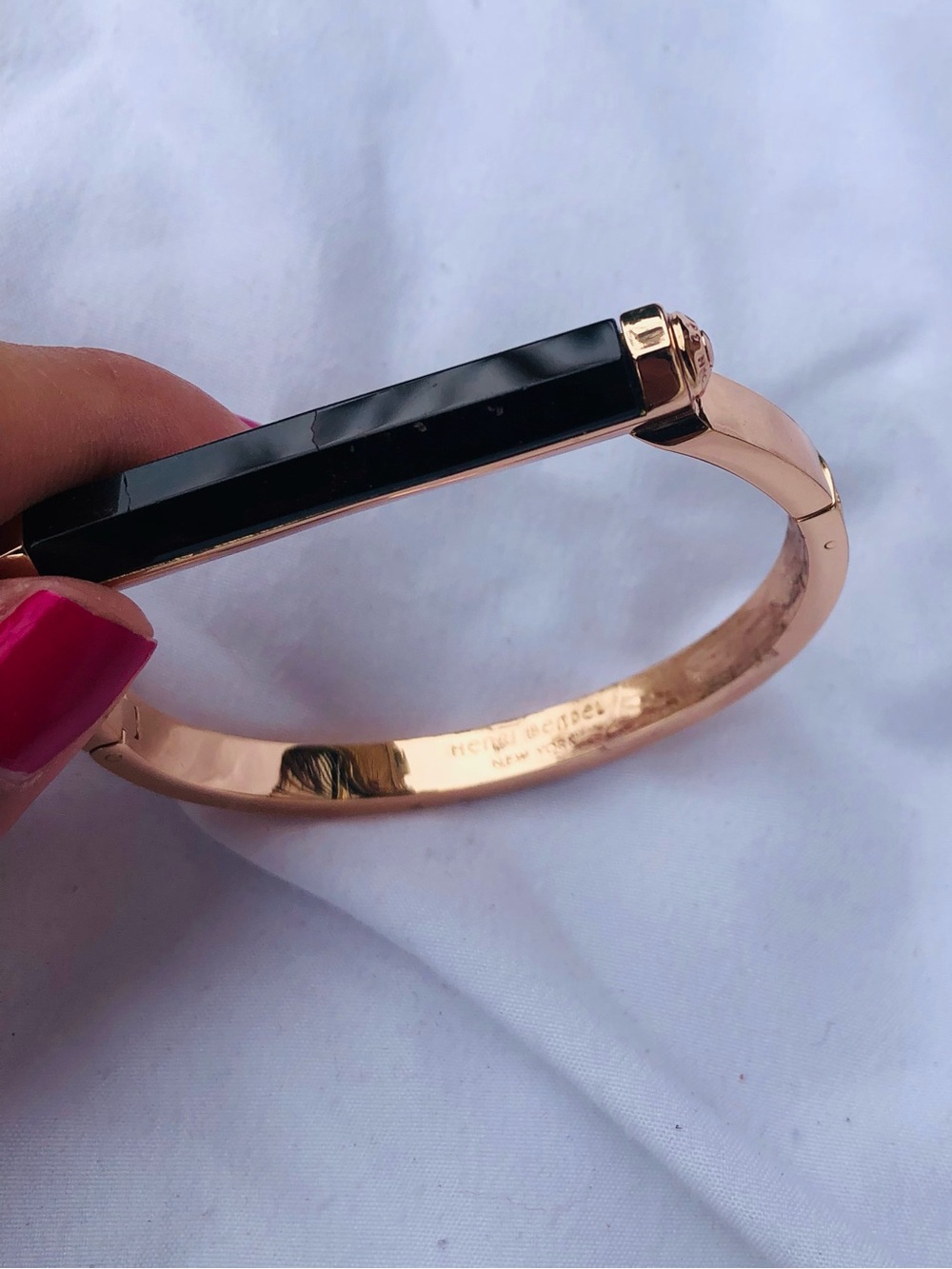 Henri Bendel rose gold bangle with black enamel bar